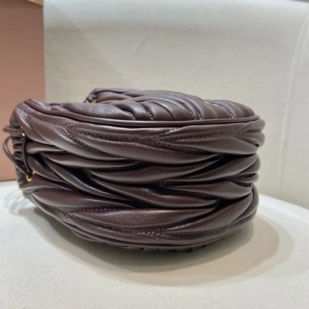 Miu Miu Matelassé Nappa Leather Pouch for Women in Burgundy Miu Miu Matelassé Nappa Leather Pouch for Women in Burgundy