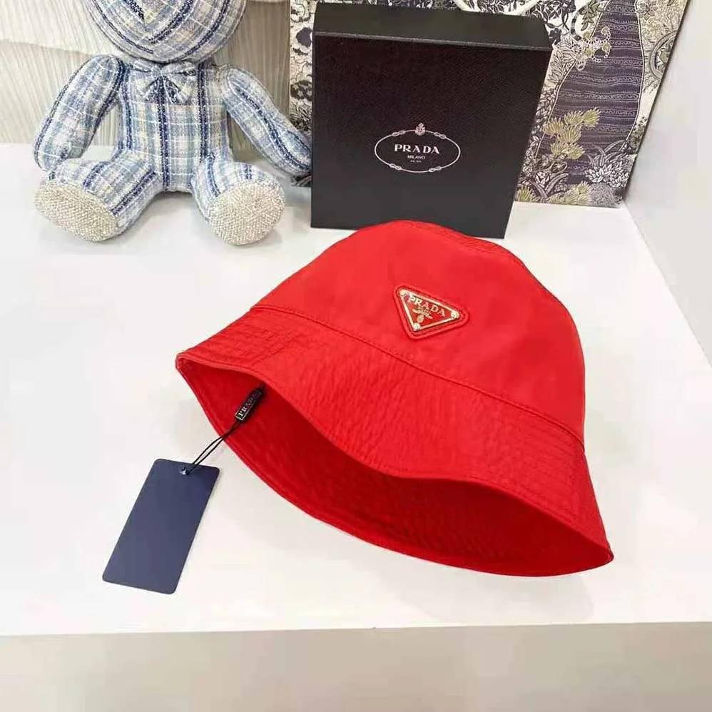 Prada Nylon Bucket Hat Decorated with the Triangle Logo for Women in Red