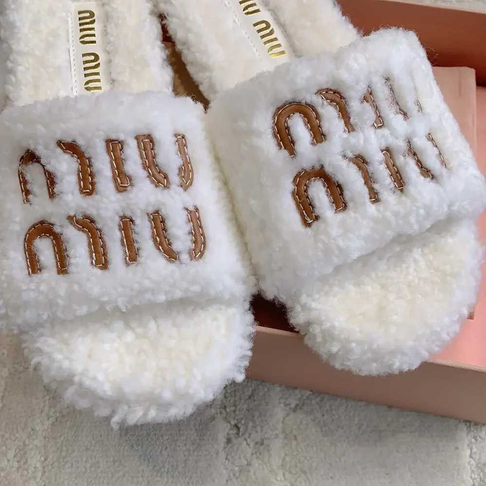 Miu Miu Shearling Slides with Leather Logo for Women