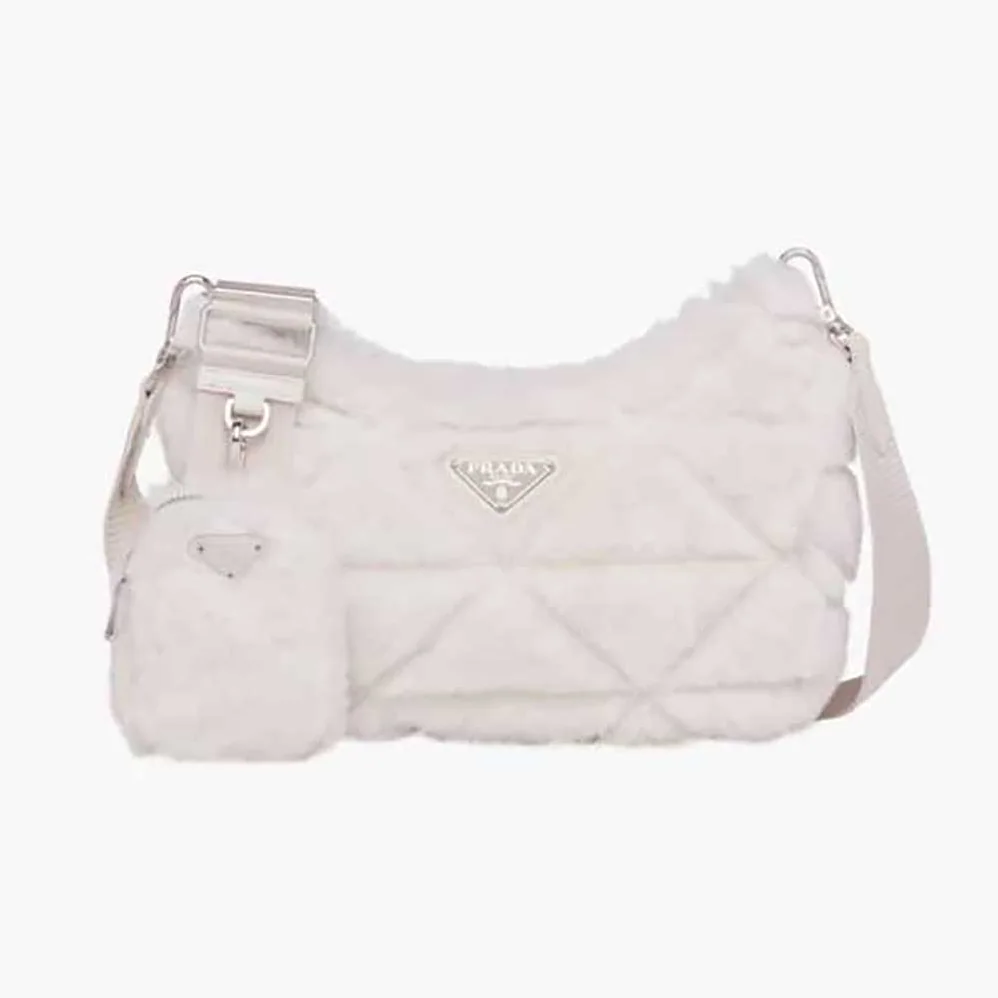 Prada A Patchwork-style Triangle Motif Characterizes Shearling Shoulder Bag for Women Prada A Patchwork-style Triangle Motif Characterizes Shearling Shoulder Bag for Women
