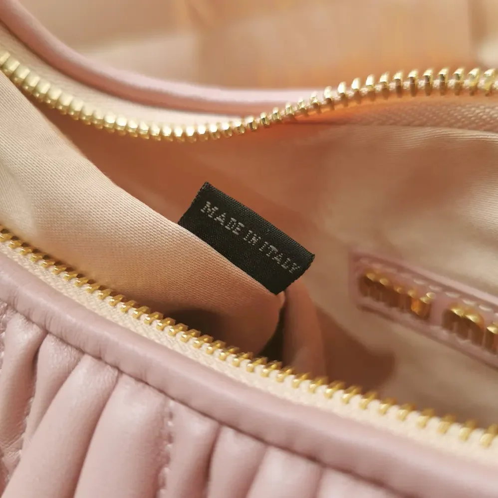 Miu Miu Wander Matelassé Nappa Leather Hobo Bag for Women in Alabaster Pink Miu Miu Wander Matelassé Nappa Leather Hobo Bag for Women in Alabaster Pink