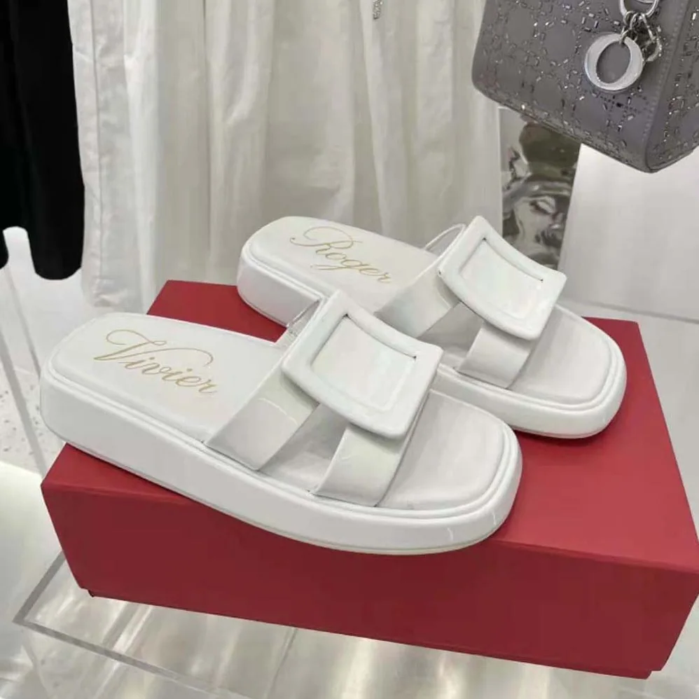 Roger Vivier Vivier Slide Covered Buckle Mules in Patent Leather for Women in White Roger Vivier Vivier Slide Covered Buckle Mules in Patent Leather for Women in White