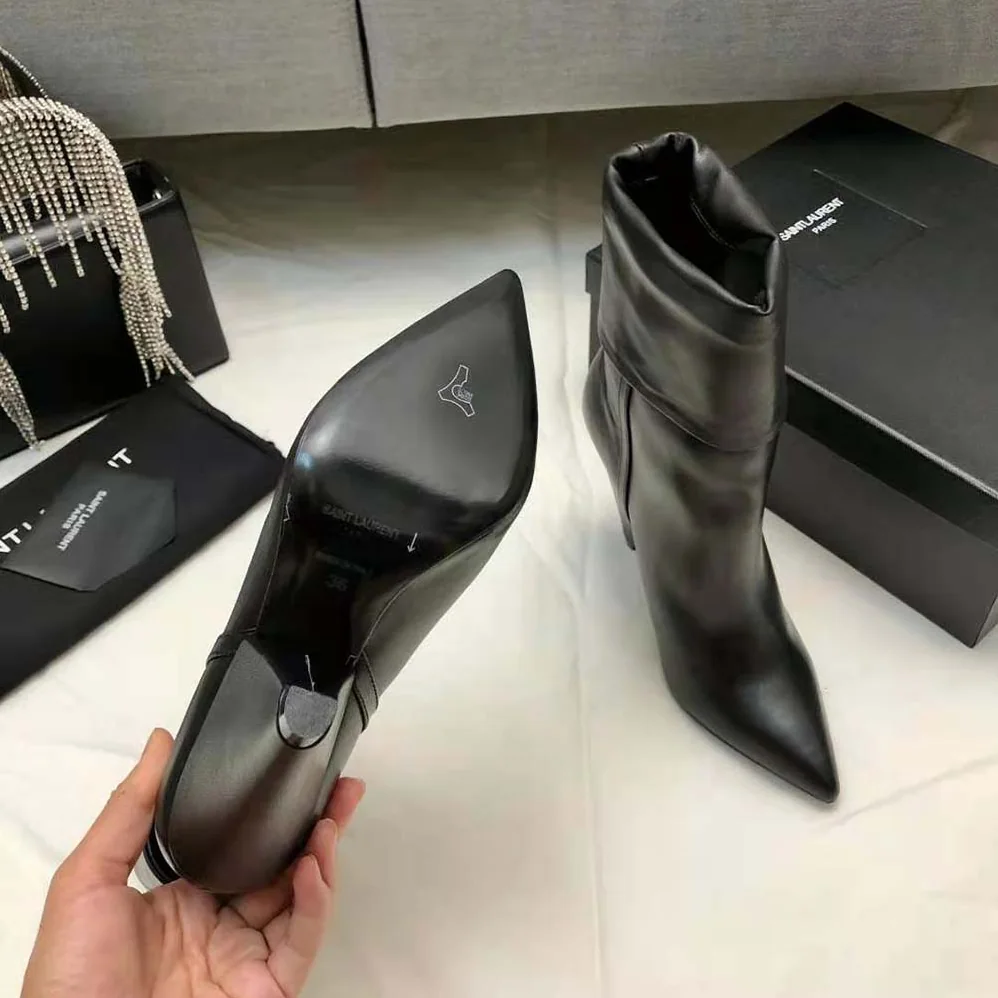 Saint Laurent YSL Niki Booties in Smooth Leather and Silver-Tone Monogram for Women in Black Saint Laurent YSL Niki Booties in Smooth Leather and Silver-Tone Monogram for Women in Black