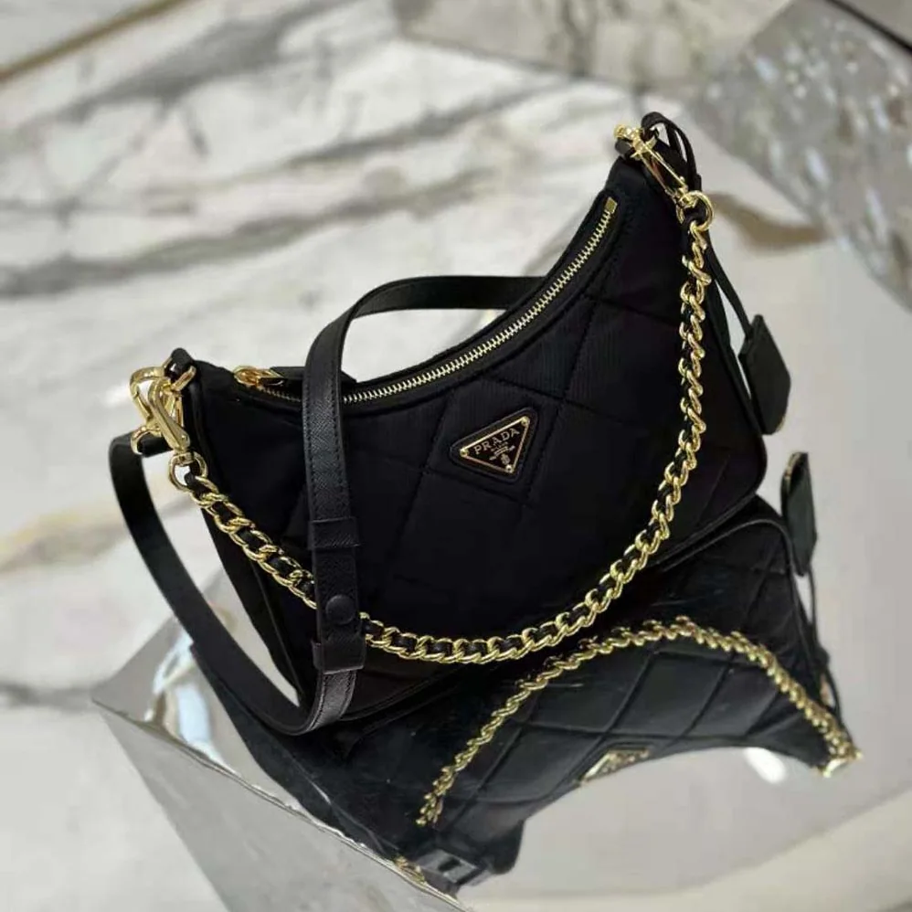Prada Re-Edition 1995 Chaîne Re-Nylon Mini-bag for Women in Black Prada Re-Edition 1995 Chaîne Re-Nylon Mini-bag for Women in Black