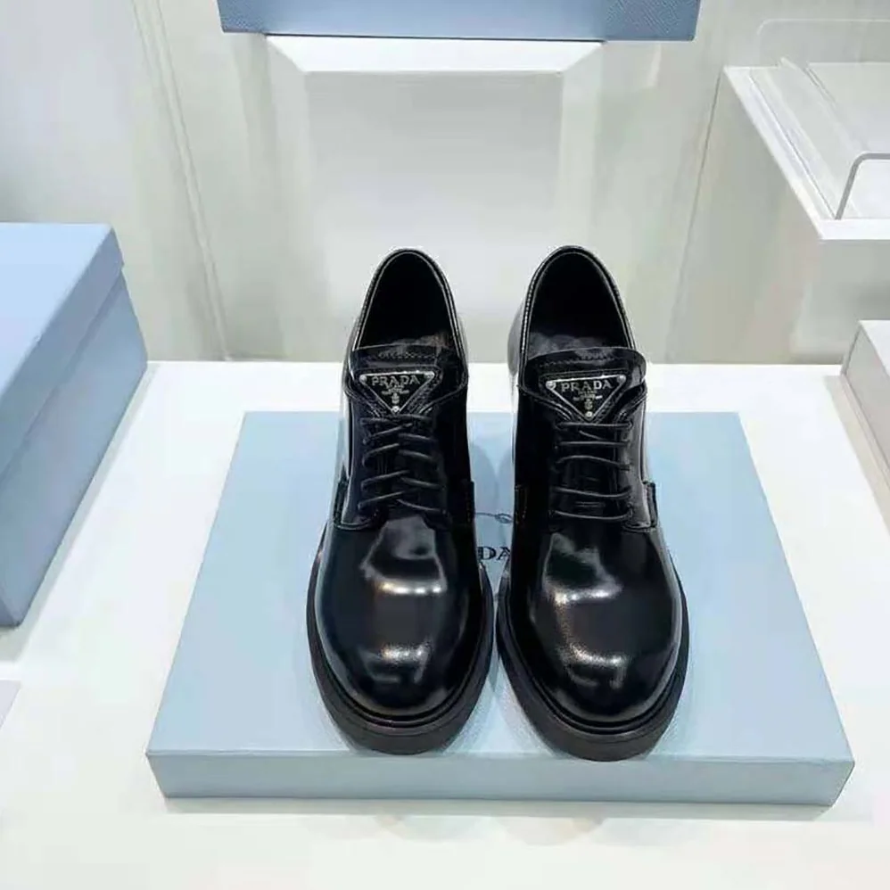 Prada Heeled Brushed Leather Lace-Ups for Women in Black Prada Heeled Brushed Leather Lace-Ups for Women in Black