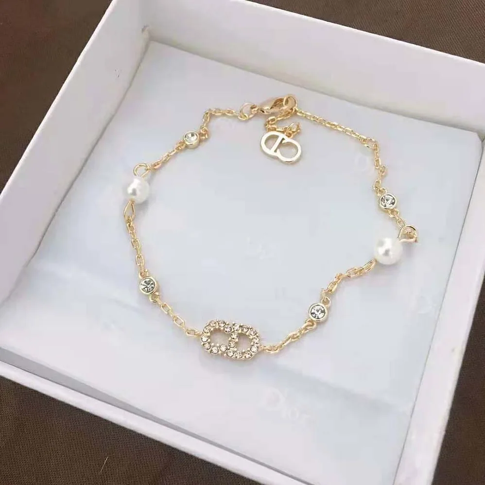 Dior Clair D Lune Bracelet Gold-Finish Metal with White Resin Pearls and White Crystals for Women Dior Clair D Lune Bracelet Gold-Finish Metal with White Resin Pearls and White Crystals for Women