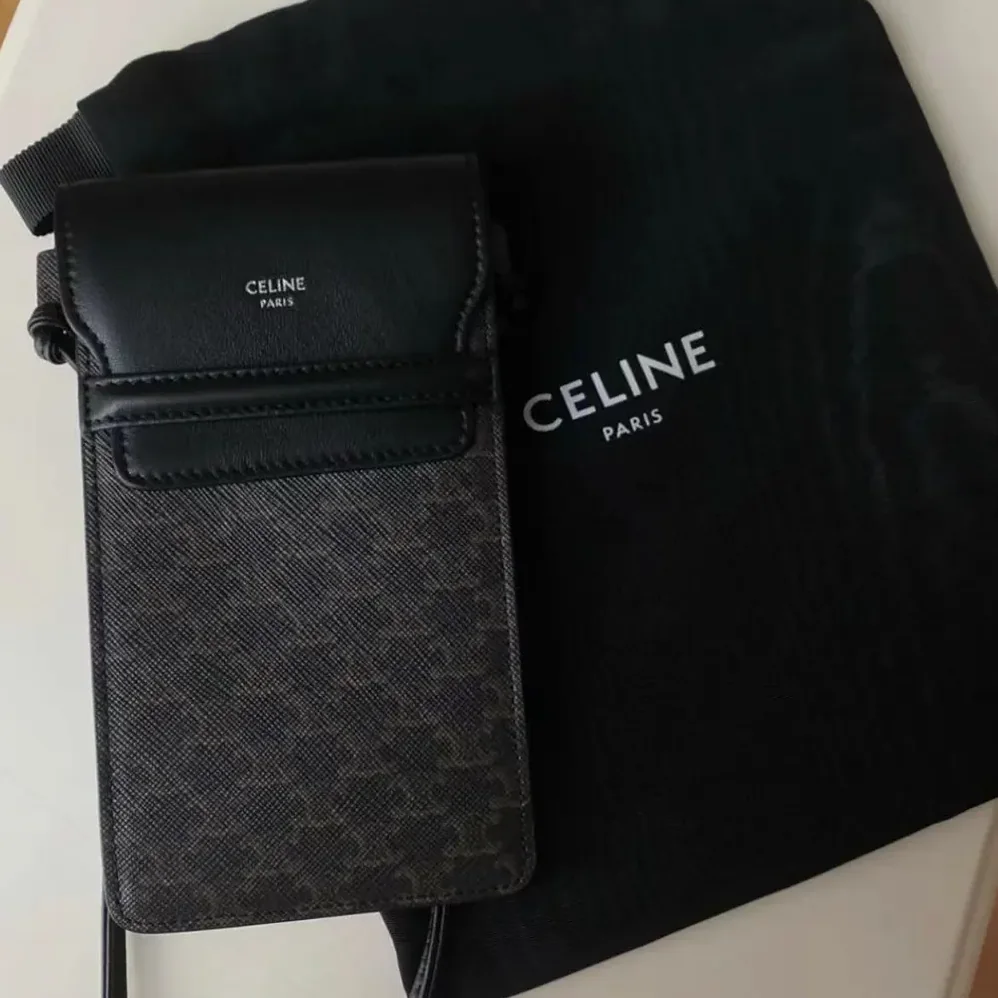 Celine Phone Pouch with Flap in Triomphe Canvas and Lambskin for Women in Black Celine Phone Pouch with Flap in Triomphe Canvas and Lambskin for Women in Black