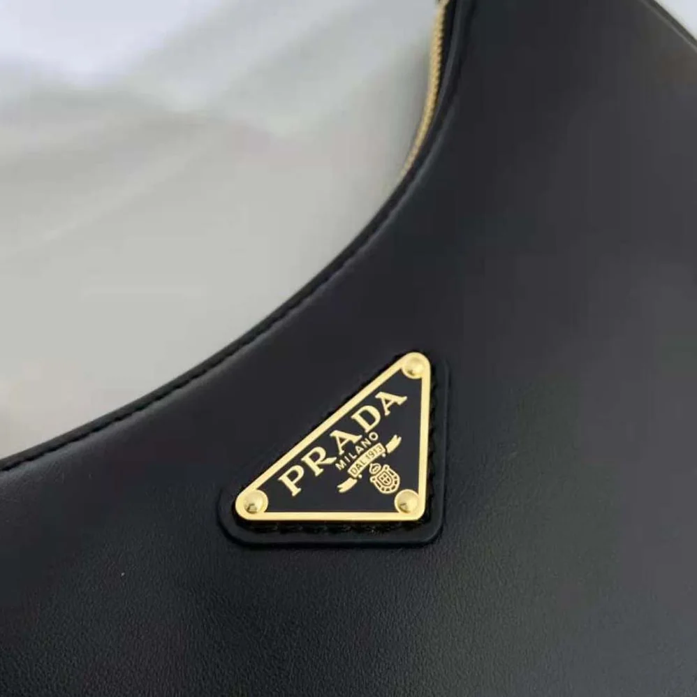 Prada Leather Shoulder Bag with Enameled Metal Triangle Logo for Women in Black