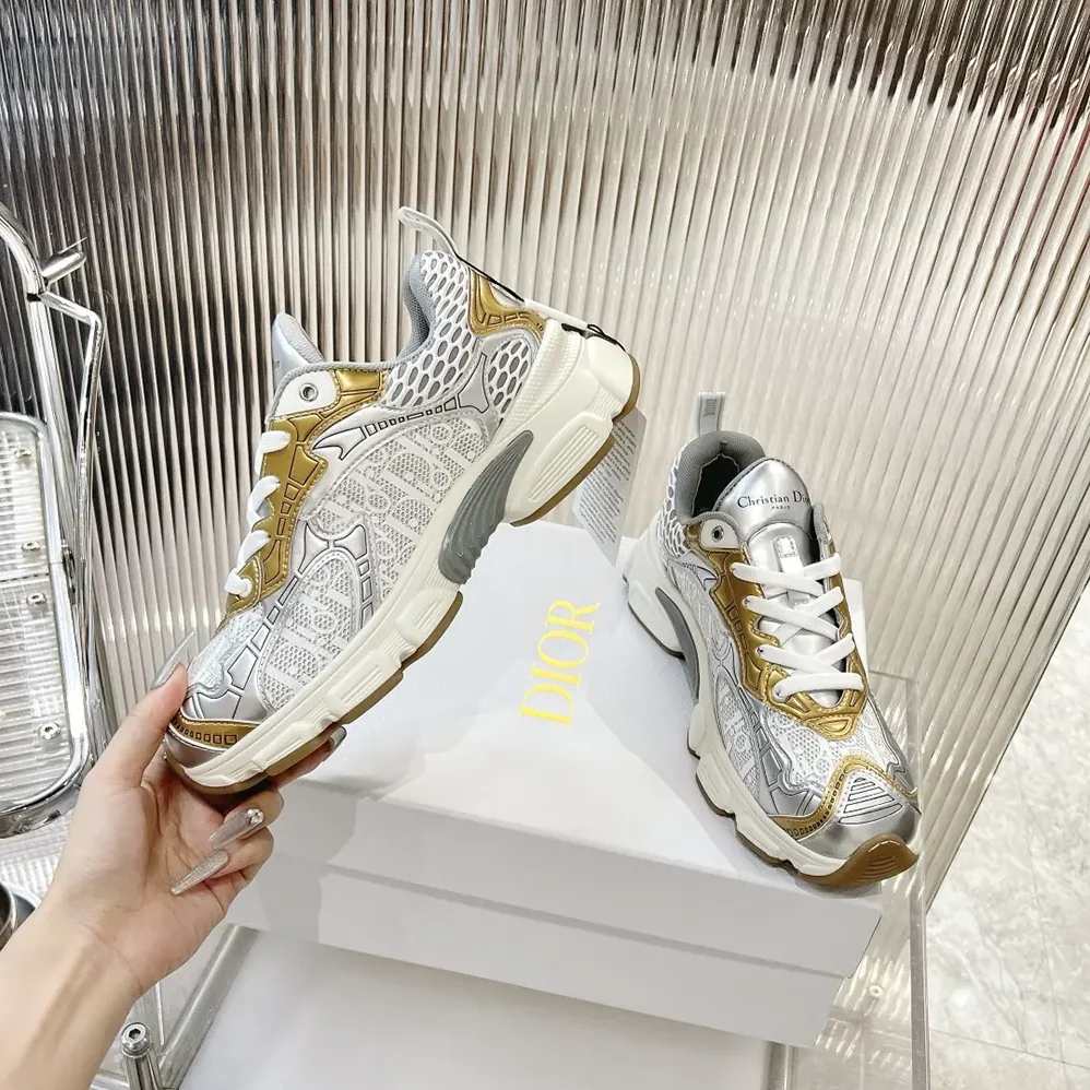 Dior Vibe Sneaker White Mesh Printed with Dior Oblique Motif and Gold- and Silver in Tone Dior Vibe Sneaker White Mesh Printed with Dior Oblique Motif and Gold- and Silver in Tone