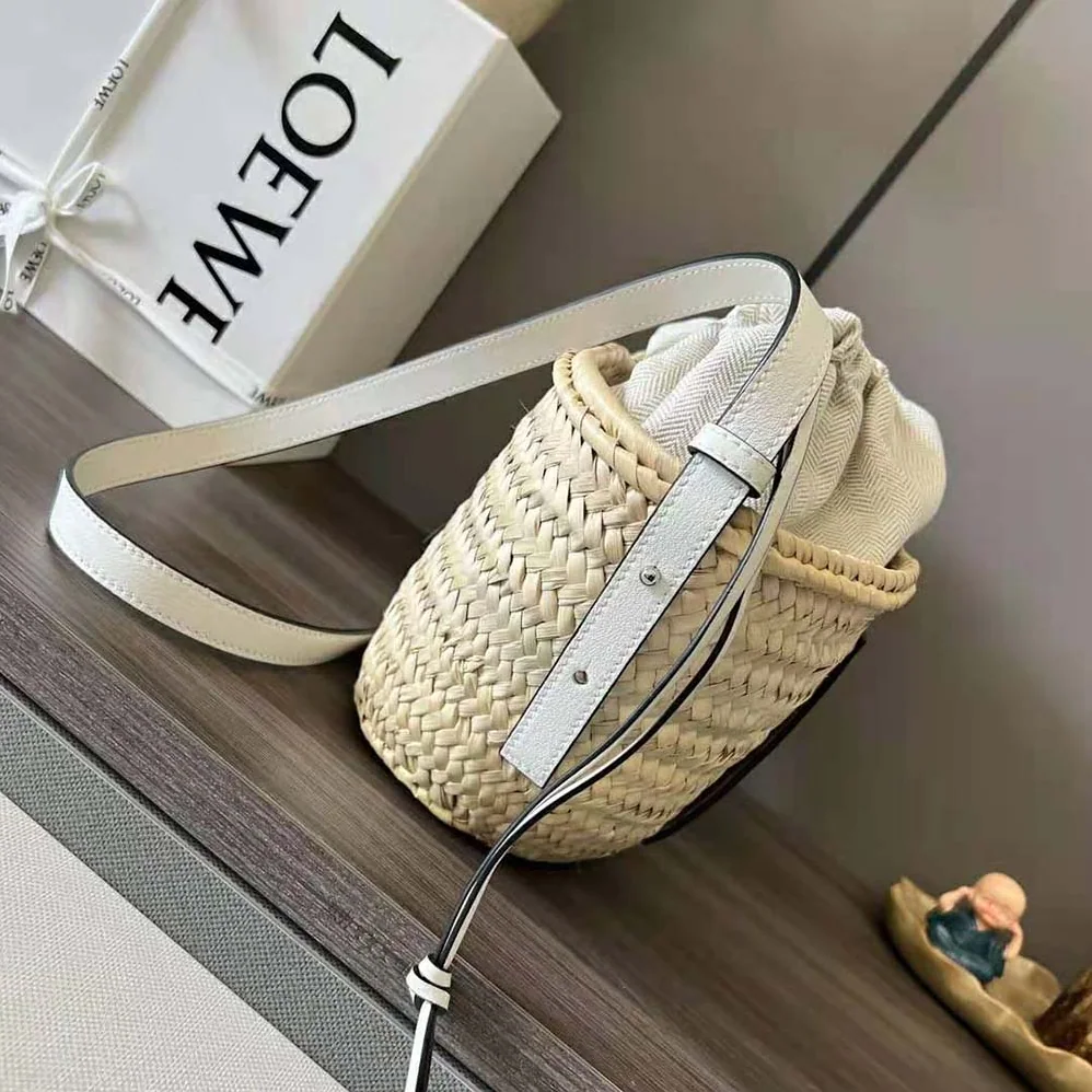 Loewe Drawstring Bucket Bag in Palm Leaf and Calfskin for Women in White Loewe Drawstring Bucket Bag in Palm Leaf and Calfskin for Women in White