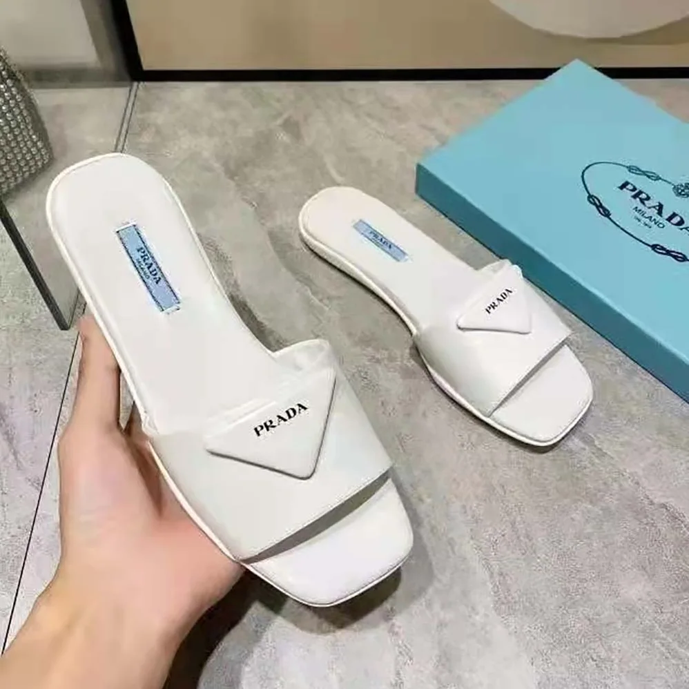 Prada Brushed Leather Slides Triangle Logo for Women in White Prada Brushed Leather Slides Triangle Logo for Women in White