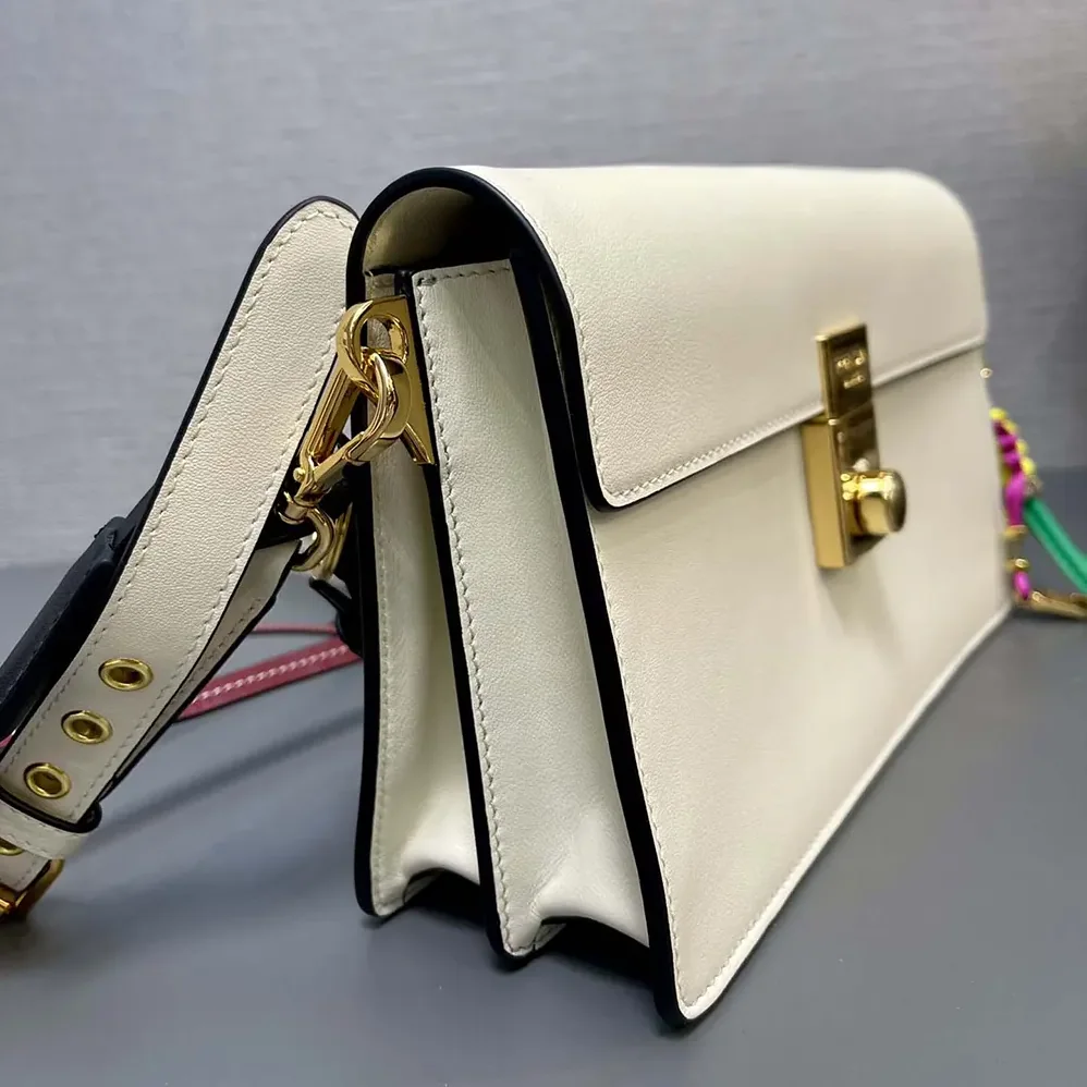 Prada Soft Sound Small Leather Shoulder Bag with Charms for Women in White Prada Soft Sound Small Leather Shoulder Bag with Charms for Women in White