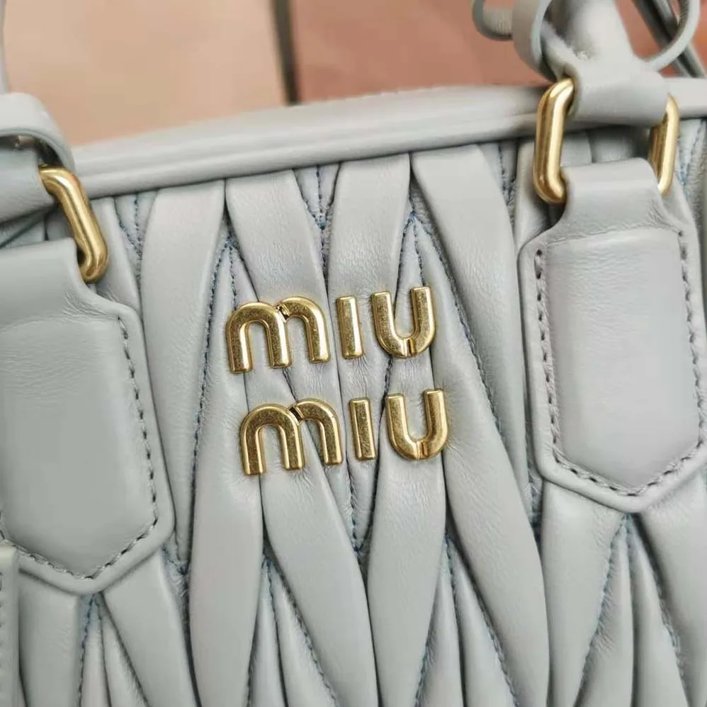 Miu Miu Matelassé Nappa Leather Top-Handle Bag for Women in Silver Miu Miu Matelassé Nappa Leather Top-Handle Bag for Women in Silver