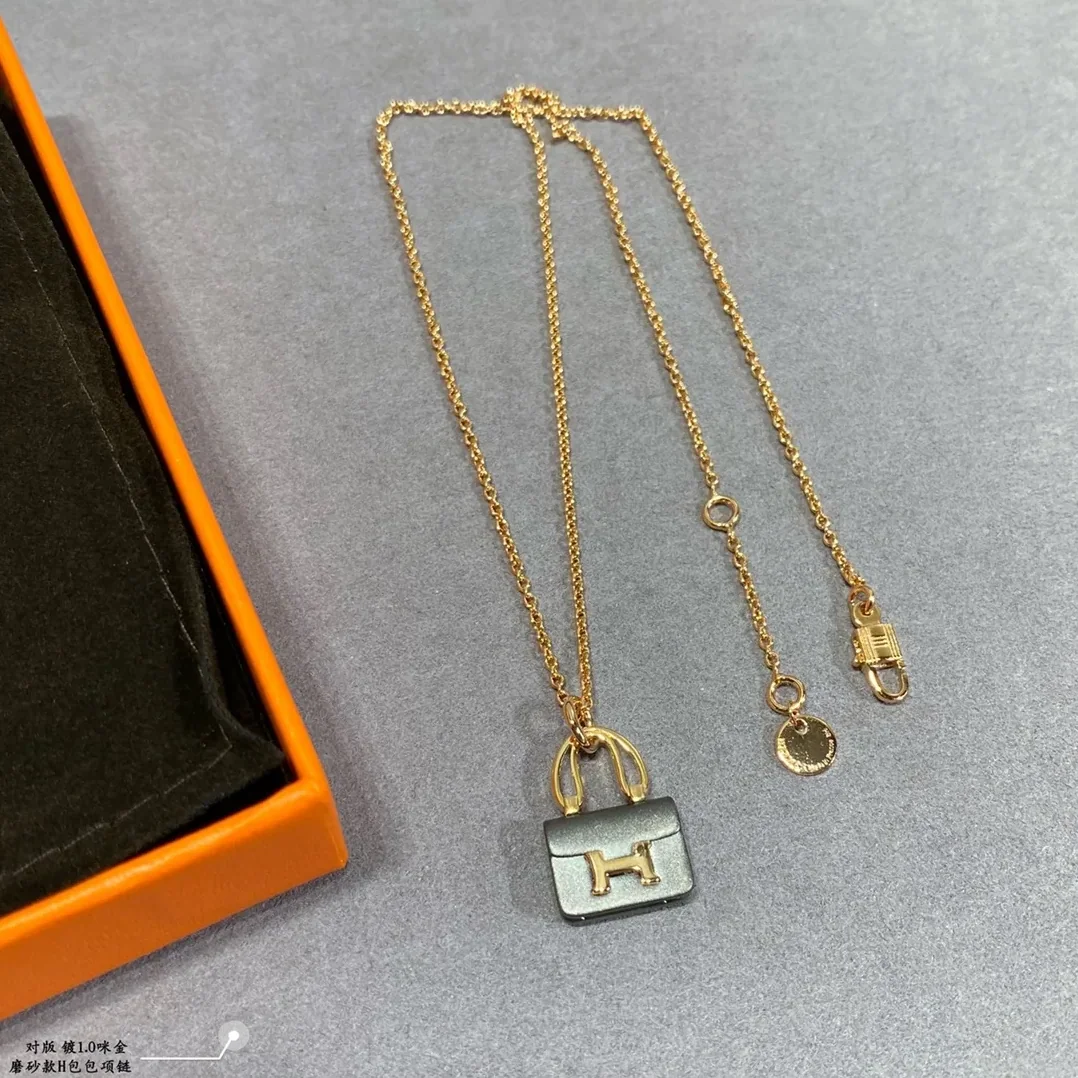 Hermes Constance Amulets Pendant Necklace Gold Tone Hermes Constance Amulets Pendant Necklace Gold Tone