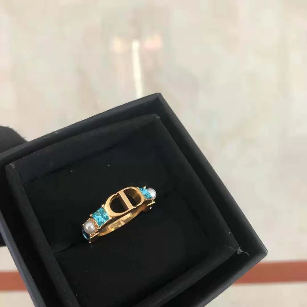 Dior Petit CD Ring Gold-Finish Metal with White Resin Pearls and Light Blue Crystals for Women Dior Petit CD Ring Gold-Finish Metal with White Resin Pearls and Light Blue Crystals for Women
