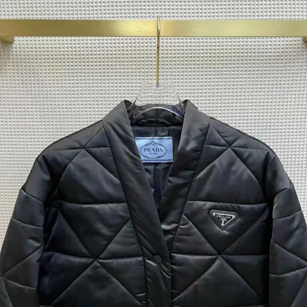 Prada Emblematic Triangle Quilted Re-Nylon Jacket for Women in Black Prada Emblematic Triangle Quilted Re-Nylon Jacket for Women in Black
