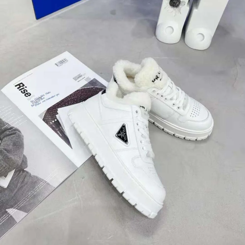 Prada Leather and Shearling Sneakers for Women in White