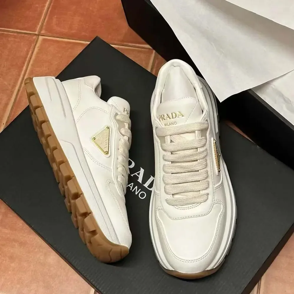 Prada Triangle Logo Leather Sneakers for Unisex in White