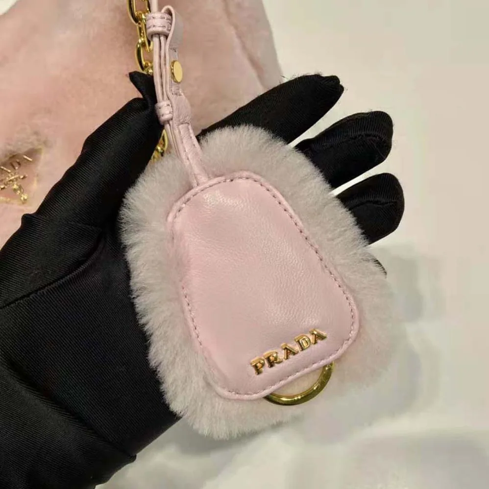 Prada Shearling Mini-Bag with the Enameled Metal Triangle Logo for Women in Pink Prada Shearling Mini-Bag with the Enameled Metal Triangle Logo for Women in Pink