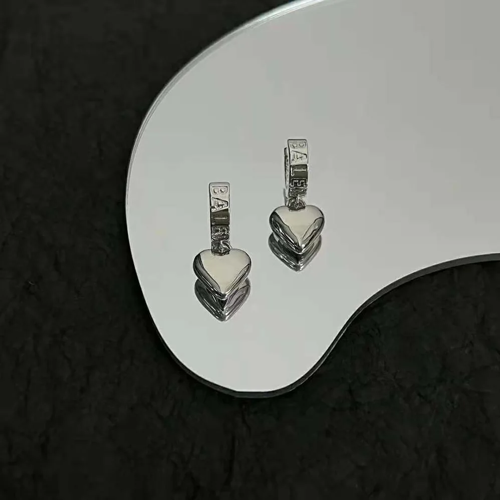 Balenciaga Sharp Heart Earrings in Silver for Women