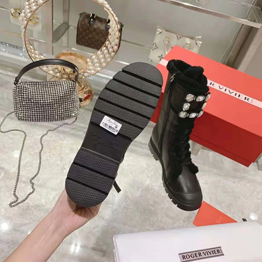 Roger Vivier Walky Viv' Shearling Strass Buckle Boots in Leather for Women in Black Roger Vivier Walky Viv' Shearling Strass Buckle Boots in Leather for Women in Black