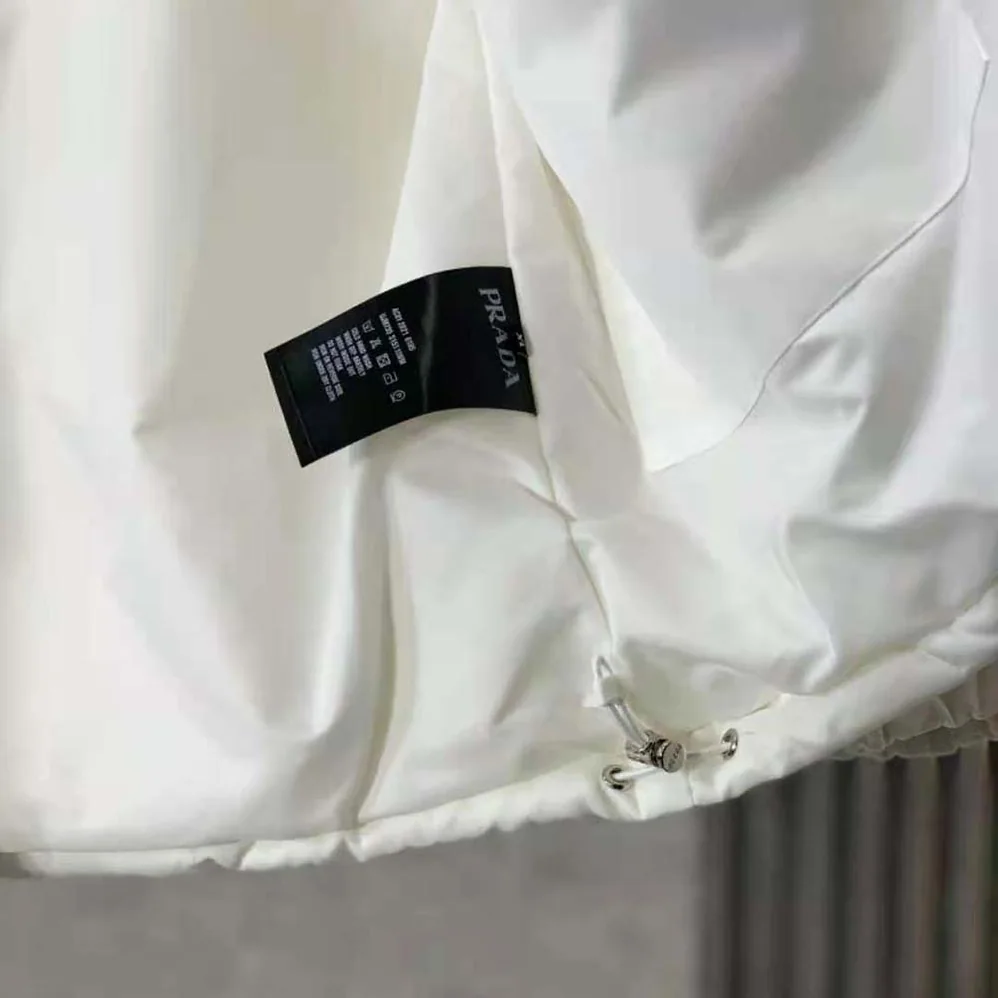 Prada Re-Nylon Down Jacket for Women in White Prada Re-Nylon Down Jacket for Women in White