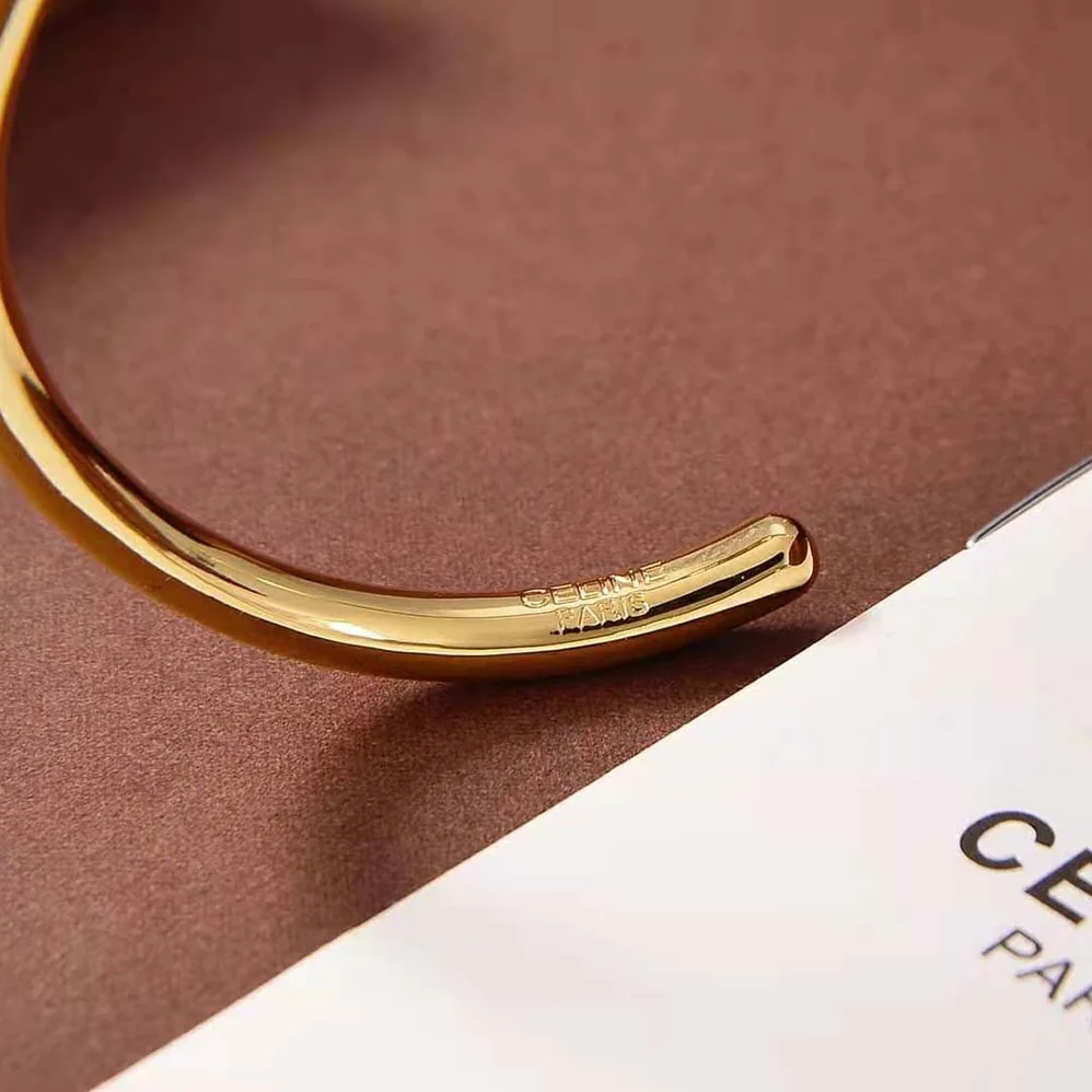 Celine Maillon Triomphe Thin Cuff in Brass with Gold Finish for Women