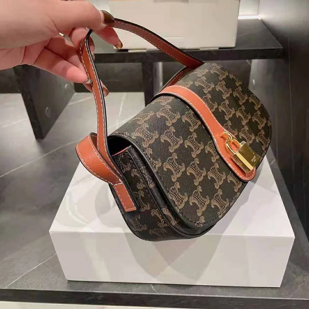 Celine Clutch on Strap in Triomphe Canvas and Calfskin for Women