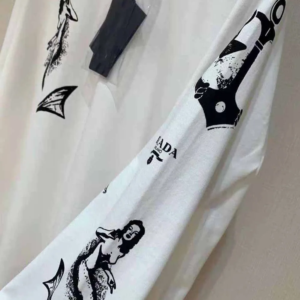 Prada Printed Cotton T-shirt with the Lettering Logo for Women in White Prada Printed Cotton T-shirt with the Lettering Logo for Women in White