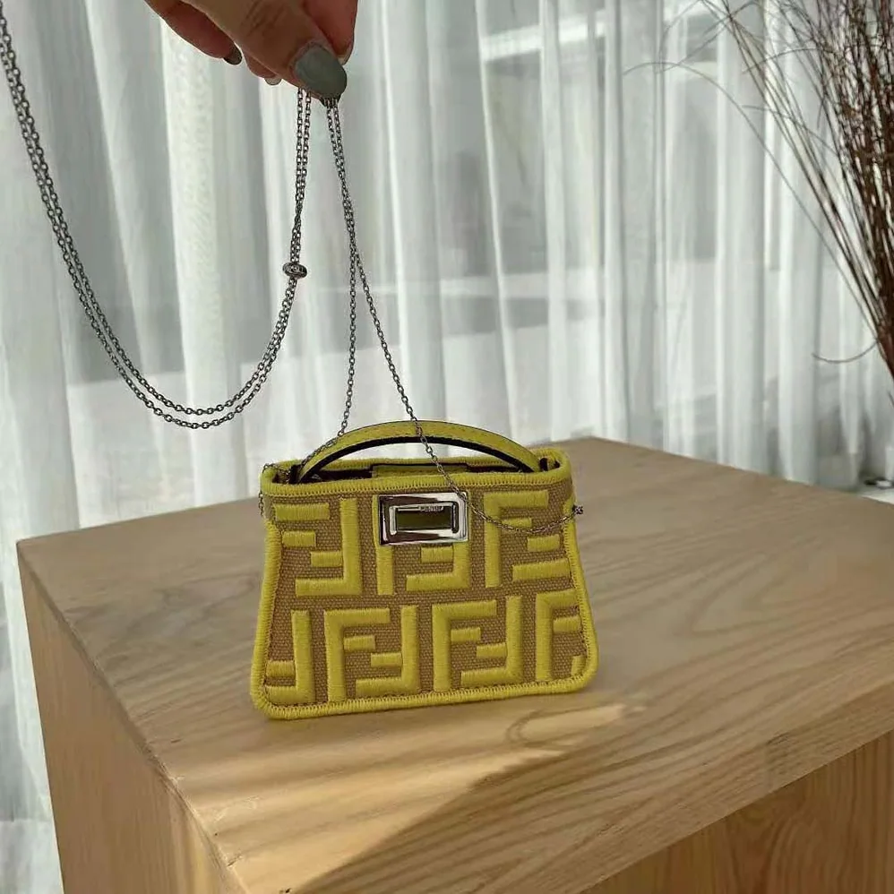 Fendi Nano Peekaboo Charm Gray FF Canvas Charm for Women in Yellow Fendi Nano Peekaboo Charm Gray FF Canvas Charm for Women in Yellow