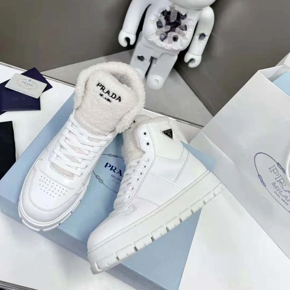 Prada Leather and Shearling High-Top Sneakers for Women in White Prada Leather and Shearling High-Top Sneakers for Women in White