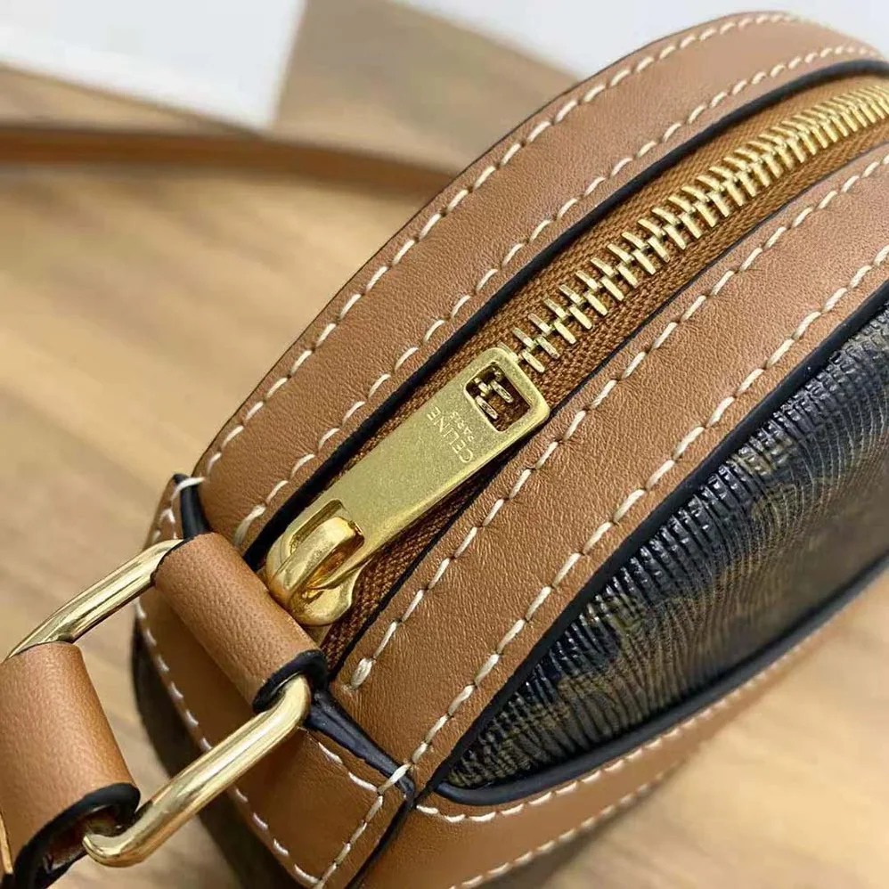 Celine Round Purse on Strap in Triomphe Canvas and Lambskin for Women