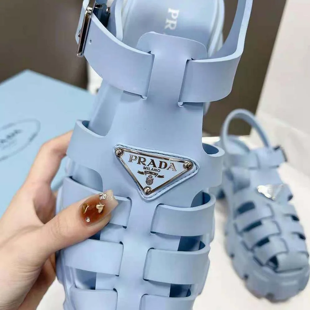 Prada Foam Rubber Sandals with Enameled Metal Triangle Logo for Women in Blue Prada Foam Rubber Sandals with Enameled Metal Triangle Logo for Women in Blue
